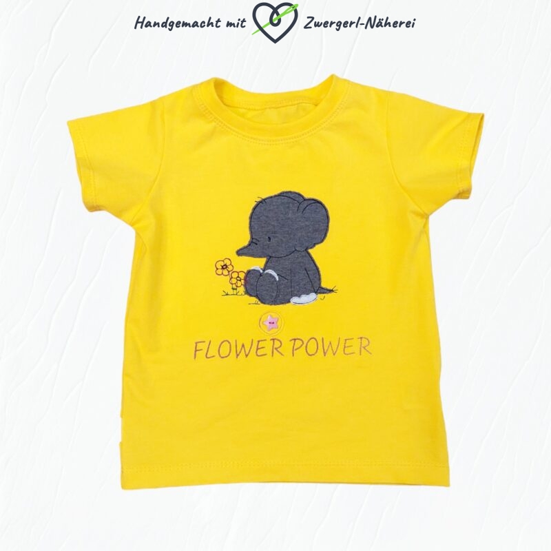 Kinder T-Shirt Gelb mit Baby-Elefant Stickapplikationen und Knopfblume aus Bio-Baumwolle Vorderansicht handmade Kindermode und Babybekleidung